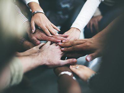 Group of hands in huddle