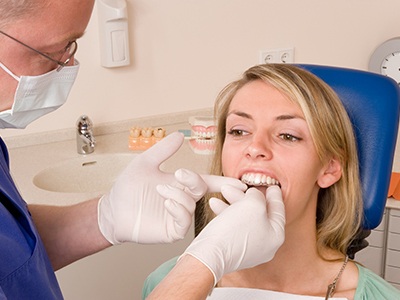 Woman at Invisalign consultation in dental office