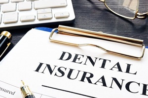 Dental insurance form on a clipboard