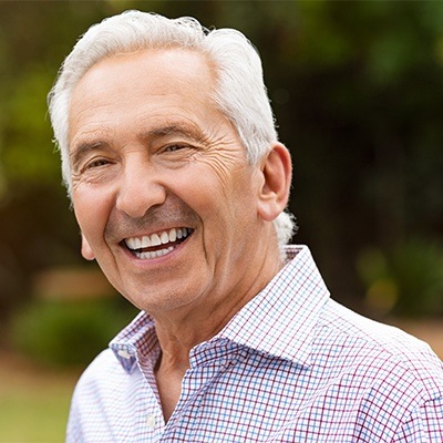 Man smiling with dentures in Fort Worth