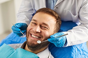 Patient smiling during dental exam