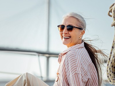 Woman smiling while on a boat