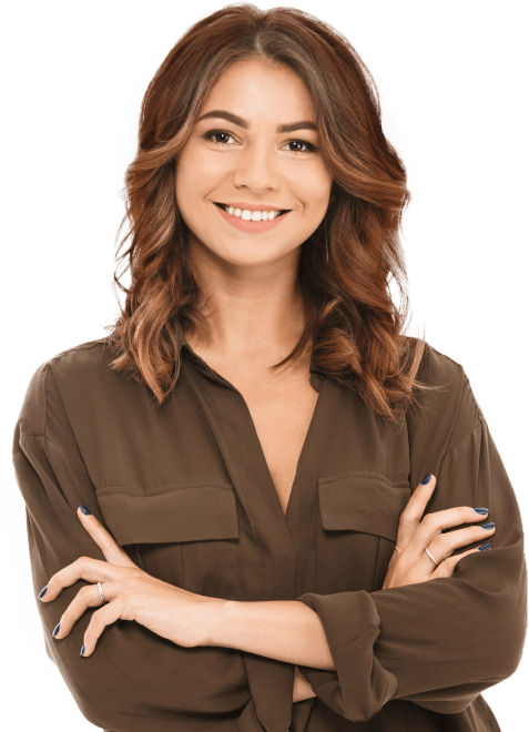 Woman in brown shirt smiling after visiting dentist in Fort Worth