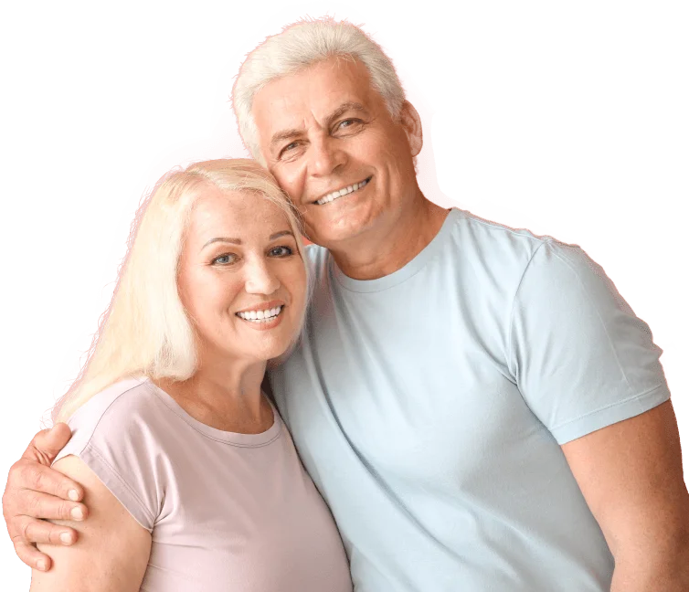 Senior husband and wife smiling and hugging from the side