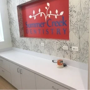 Summer Creek Dentistry sign on wall of dental office