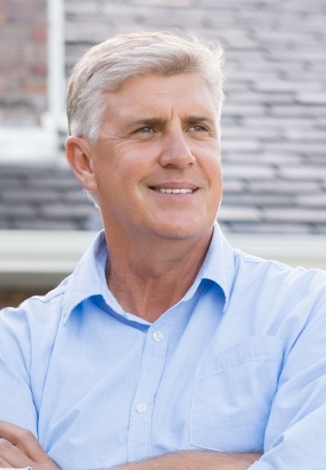 man in blue shirt smiling