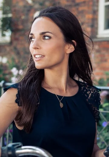Woman in dark blue dress outside