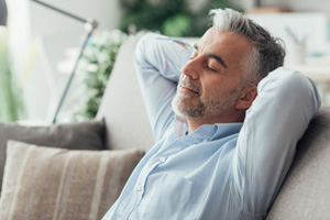 a man relaxing while sitting at home