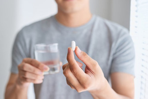 a person about to take pain medication