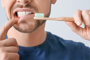 a man preparing to brush his teeth