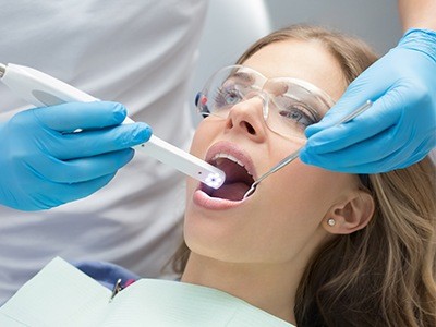 dentist using intraoral camera