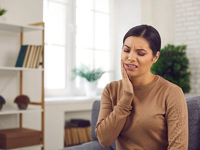 Closeup of woman experiencing toothache at home