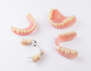 Variety of dentures on a white background